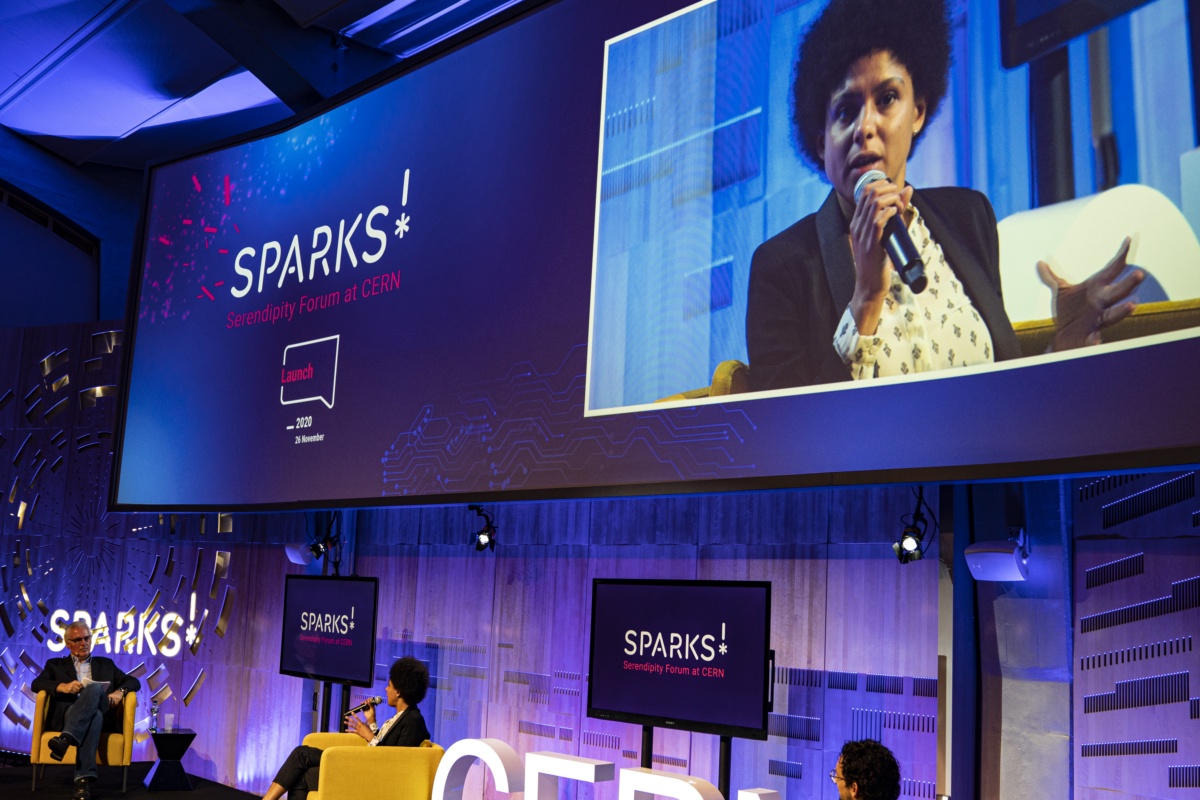 Sparks! host Bruno Giussani, left, interviews physicists Jennifer Ngadiuba and Michael Kagan to see how CERN uses AI to analyse data from the Large Hadron Collider