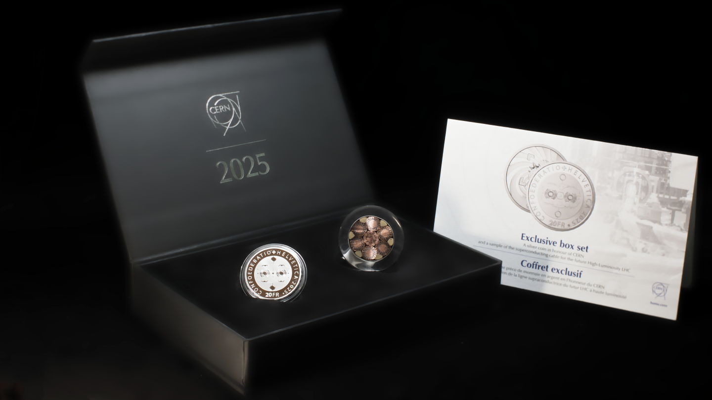 Box containing a coin and a slice of a superconducting cable