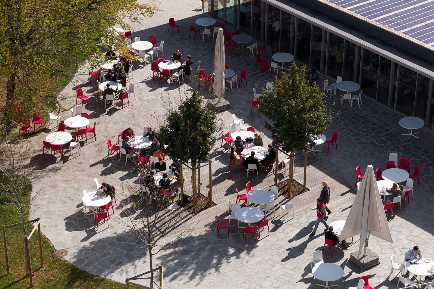 Aerial photo of CERN restaurant 1's terrace with people sitting at tables