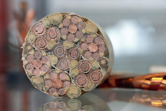 “ROSETTE” by Corinne Longhi. Close-up of the cross-section of the new superconducting cables being developed at CERN’s main workshop.
