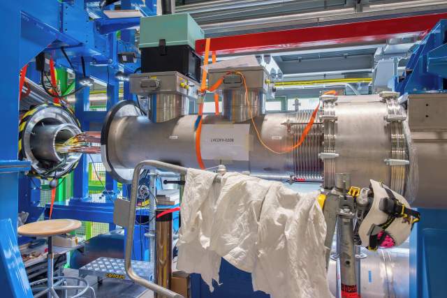 “Testing and developing” by Theodore Lianopoulos. DFX cryostat for the inner triplet magnets in the tunnel.