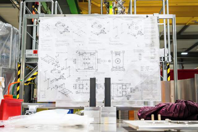 “Calculations and planning” by Matteo Monzali. Technical drawings and schematics of the new superconducting radiofrequency cavities for the HL-LHC.