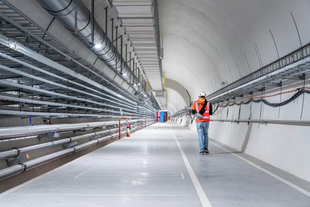 “Tunneling” by Agis Petropoulos. A safety officer walking through the new HL-LHC underground caverns at Point 1.