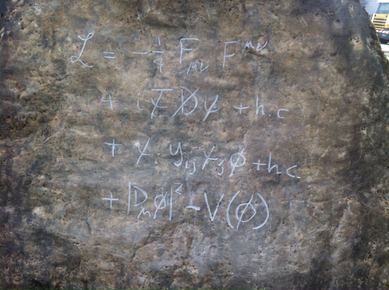The standing stone outside the CERN Control Centre, engraved with an equation representing the Standard Model of particle physics (Image: CERN)