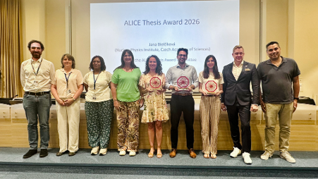 People standing in front of a screen reading 'ALICE Thesis Award 2026'